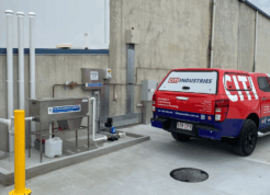Covered commercial wash bay with drainage and cleaning systems, compliant with Australian wash bay requirements.