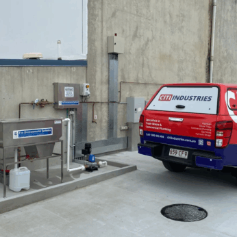 Covered commercial wash bay with drainage and cleaning systems, compliant with Australian wash bay requirements.
