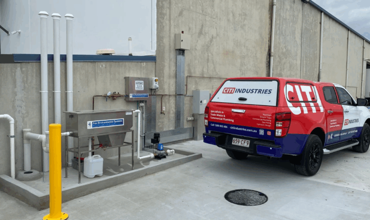 Covered commercial wash bay with drainage and cleaning systems, compliant with Australian wash bay requirements.