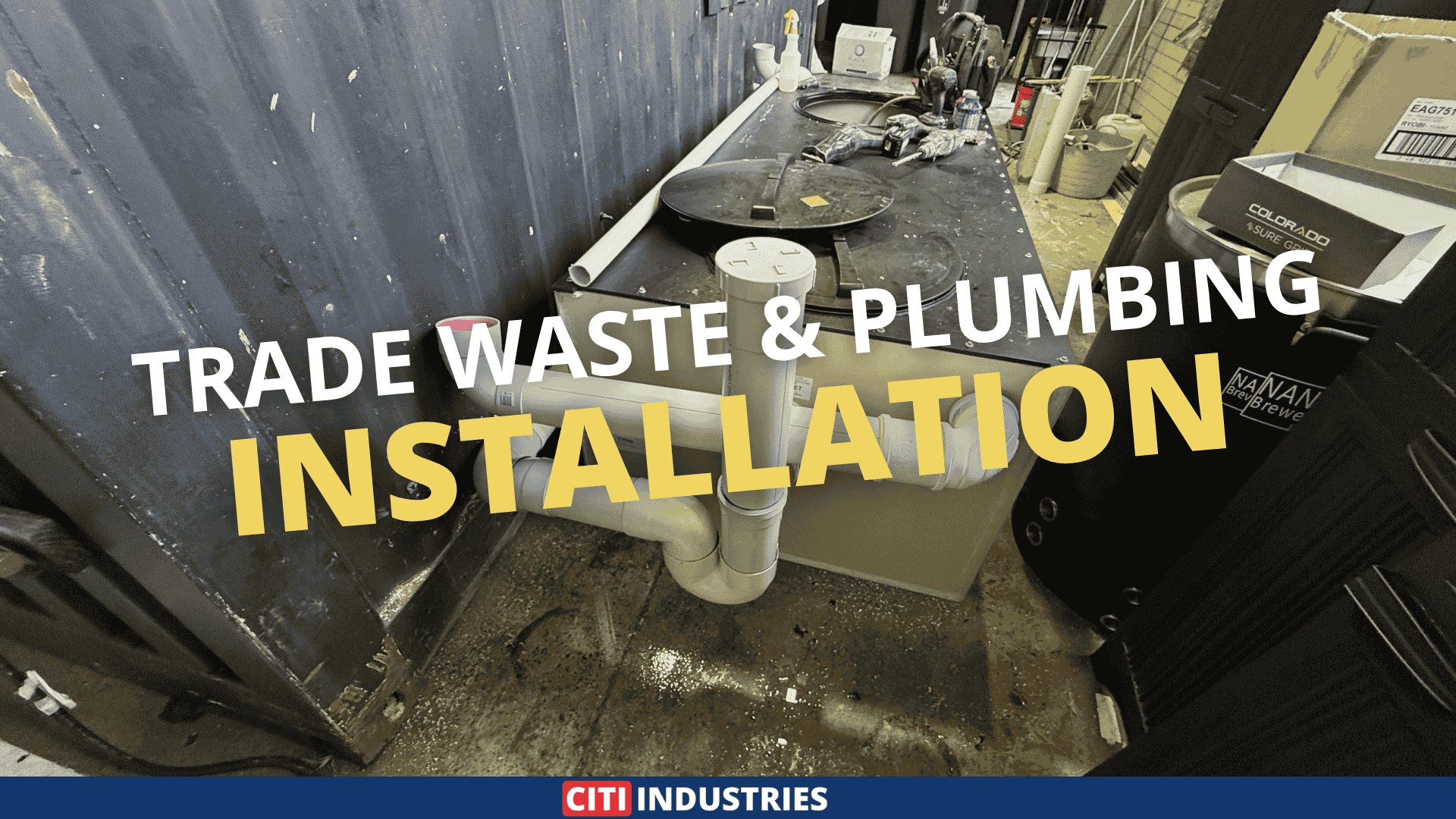 Trade waste plumbing brewery installation showing internal above-slab drainage pipework and trade waste connections at a craft brewery fit-out in Brisbane, Queensland.