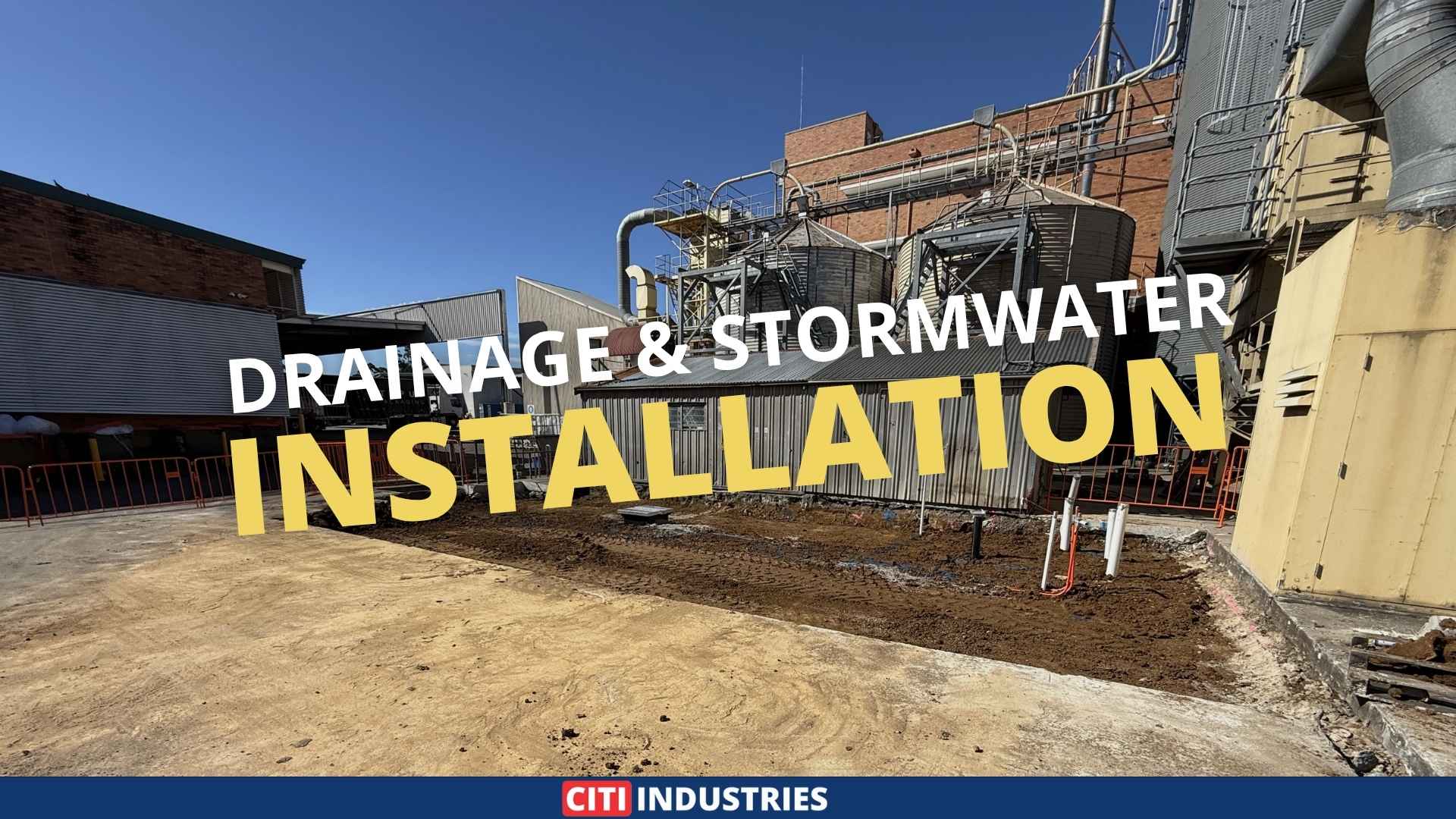 Industrial washbay drainage system installation at a food manufacturing facility in Moorooka Queensland, showing external drainage groundworks and stormwater infrastructure. 