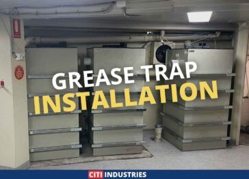 Commercial grease trap system installed at a Brisbane brewery for trade waste compliance, showing stacked grease trap units with drainage connections.