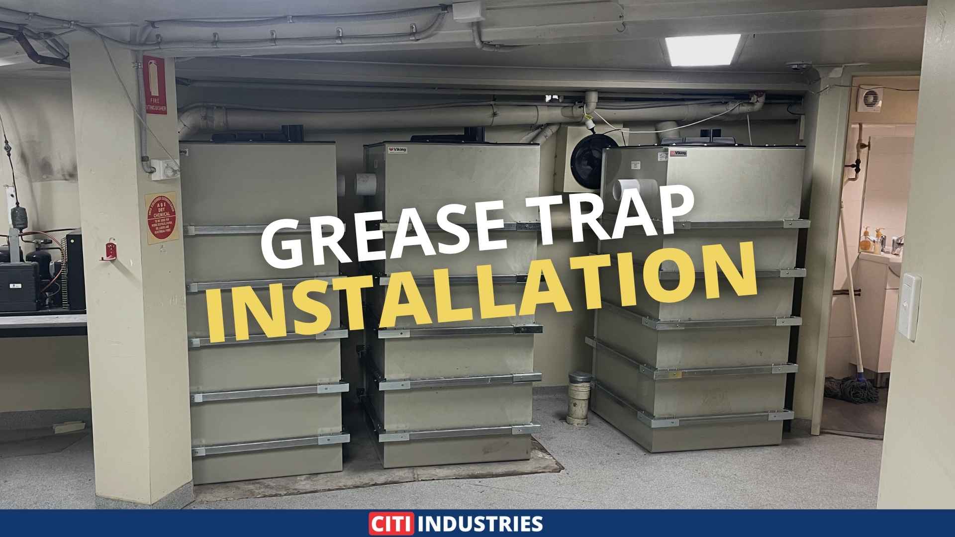 Commercial grease trap system installed at a Brisbane brewery for trade waste compliance, showing stacked grease trap units with drainage connections.