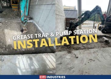 Excavation and concrete cutting for a commercial grease trap installation at a shopping centre in Mt Gravatt, showing prepared pit and mini excavator on site for grease trap upgrade works.