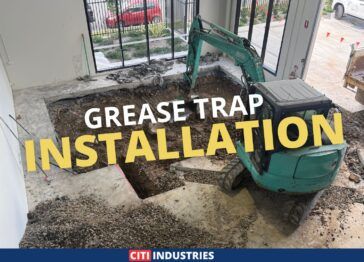 Commercial grease trap installation in Acacia Ridge, QLD, showing indoor excavation works in preparation for underground plumbing and grease trap placement.