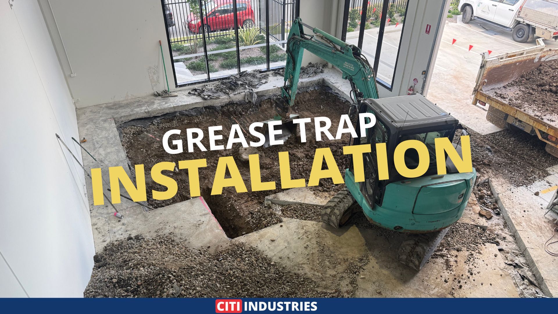 Commercial grease trap installation in Acacia Ridge, QLD, showing indoor excavation works in preparation for underground plumbing and grease trap placement.